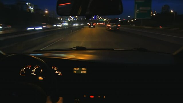 Night car driving on city highway at high speeds, overtaking other cars.  POV. HD shot from car interior. Driving on E5 road in Istanbul with a car mounted video camera 
