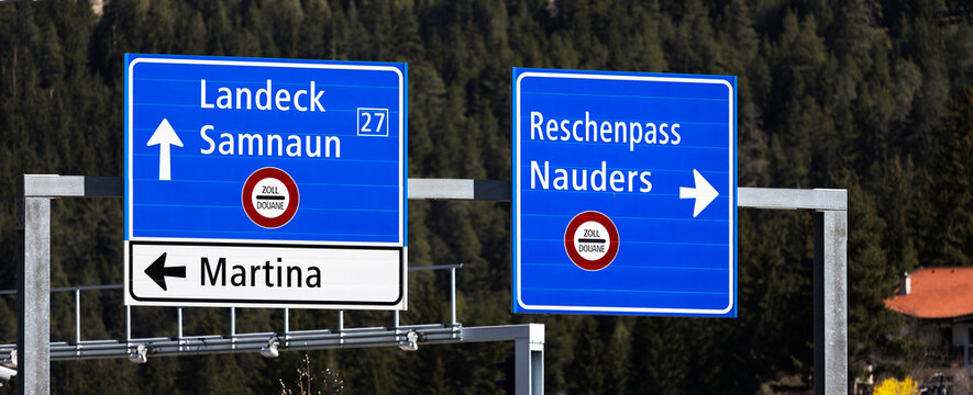 street signs of the reschenpass and landeck panorama