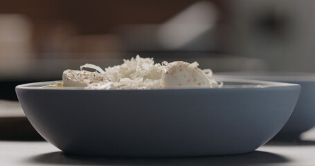 sprinkle penne with mozzarella and pesto with aged grated cheese