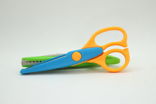 
Colorful School Scissors For Children With Wavy Edge Cutting. School Supplies To Cut Papers. Accessory For Students And Craftsmen On White Isolated Background. Wavy Tooth Scissors For Arts And Crafts