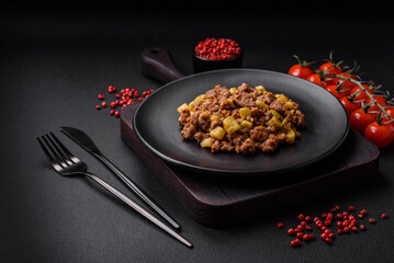 Tasty dish consisting of zucchini, beef meat, mushrooms, onions and garlic