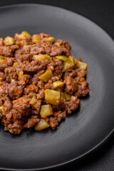 Tasty dish consisting of zucchini, beef meat, mushrooms, onions and garlic