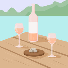 glass of rose wine, bottle and cheese  on a sea or ocean and mountains background