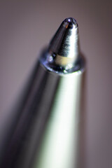 Macro photo of the metal tip of the ballpoint pen.