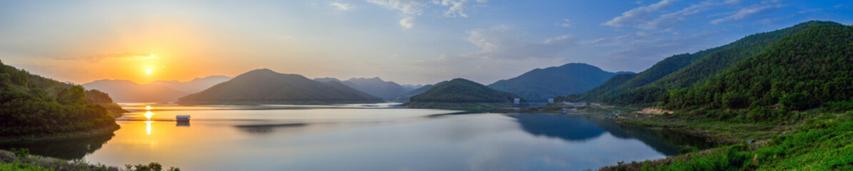 panorama Mountains forest lake landscape in rainy season with sunset sky and clouds background, Chiang mai, Thailand