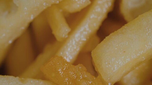 Chak Chak - fried crunchy honey cake on rotating surface - close up, macro. Traditional Tatar and Bashkir cuisine, oriental dessert, gastronomy, pastry, food and Tatarstan national sweet concept