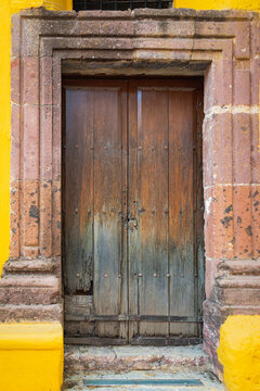 Vertical Shot of Antique Colonial Style Wooden Door