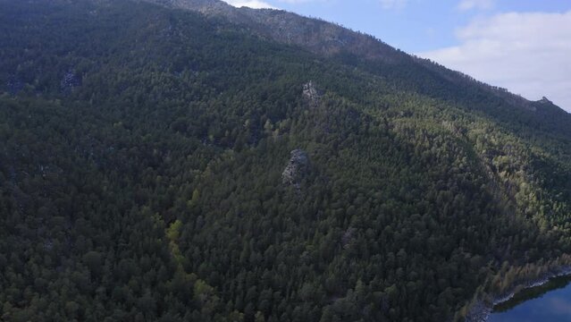 Aerial drone footage of rock remnant near the Lake Great Chebachye Lake in Natonal park Burabay Borovoe. Kazakhstan
