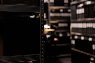 Empty evidence room equipped with metallic shelves full with federal confidential documents,...