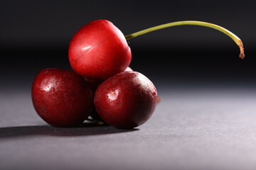 cherries on a black background