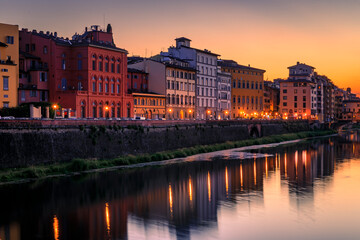 Famous Ponte Vecchio bridge on the river Arno River at sunset, Florence, Italy