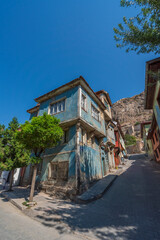 Colorful houses with local architecture in the lower part of the Afyon castle located on the top of the mountain