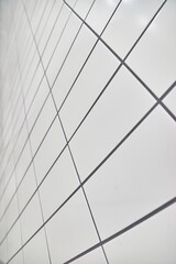White tiles on a plain wall