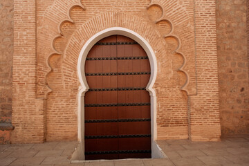Beautiful moorish arch door entrance to a mosque in the  Marrakech Medina of Morocco