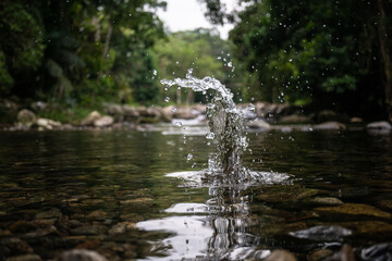 Splash made with a stone falling into the water of the waterfall in Paraty in Rio de Janeiro