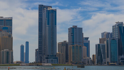Fototapeta na wymiar Sharjah city view, high rise buildings with lagoon