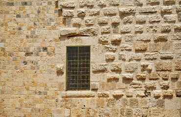 Fototapeta na wymiar Fragments of historical buildings in the old part of Jerusalem. Old city.