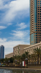 Sharjah city view, high rise buildings with lagoon