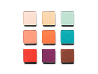 Eye shadow pans nude puple blue green brown orange isolated on white background. Cosmetic product swatch