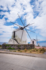 Fototapeta na wymiar Corvo Island, Azores - Ancient windmills by the coast