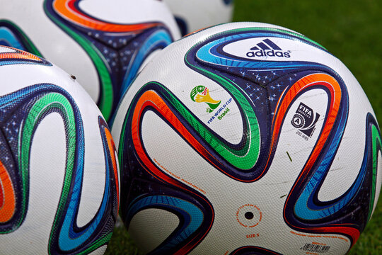Close-up official FIFA 2014 World Cup balls (Brazuca) on the grass