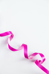 Pink ribbon for wrapping gifts on white background.