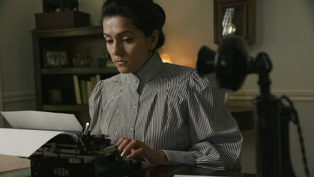 vintage woman using a typewriter