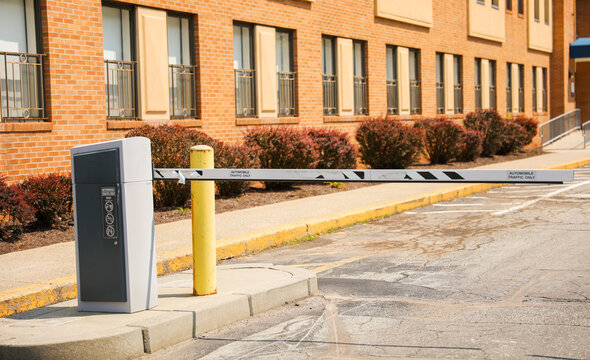 Parking lot gate: a symbol of access control, security, order, and the transition between public and private spaces