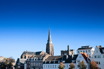 Panorama of the Maastricht Waterfront on the Meuse Maas river with a focus on the Sint Martniuskerk, a catholic church, and the ridder brewery in maastricht, Netherlands.