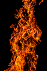 Orange red fire flame against black background, abstract texture