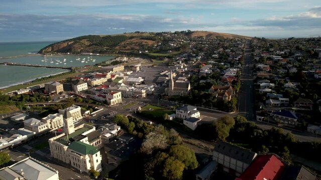 Oamaru city centre with historic buildings. Aerial panoramic of New Zealand coastal town.
