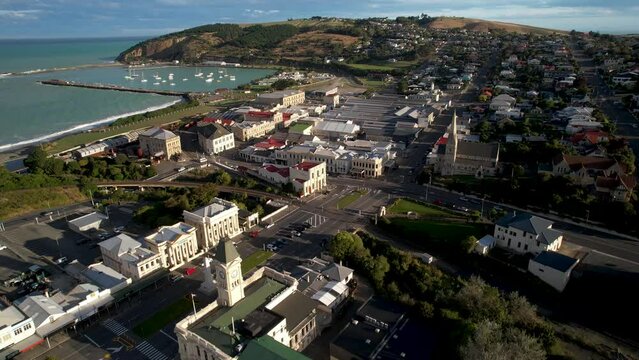Oamaru coastal picturesque town on New Zealand coastal. Drone flyover historic buildings.