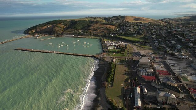 Oamaru waterfront with harbour, Beautiful sunny day at New Zealand coast. Aerial drone cityscape