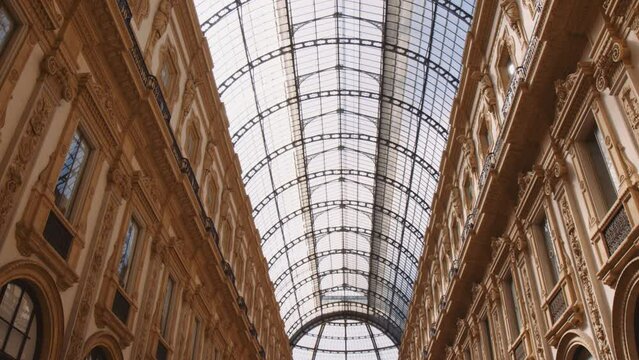 Arched Glass Ceiling Of The Oldest Shopping Centre Of Galleria Vittorio Emanuele II In Milan, Italy. Low Angle