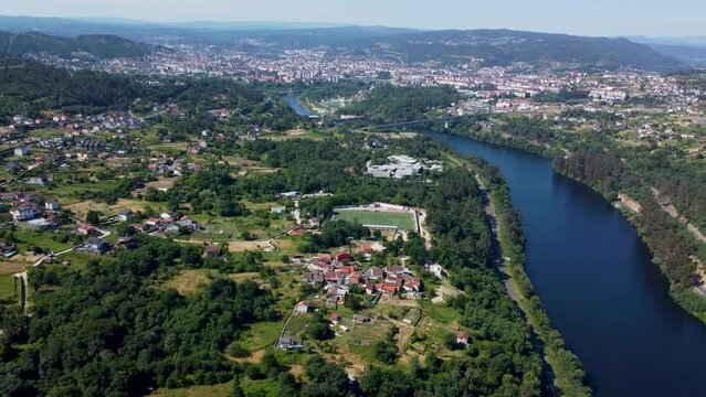 Ourense and velle scenic beautiful towns of spain by the river mountains, aerial trucking pan