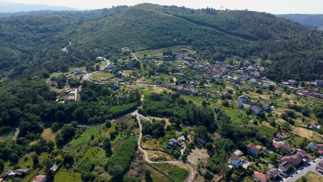 Aerial overview of peaceful spanish town of Velle, ourense, galicia, in the mountains