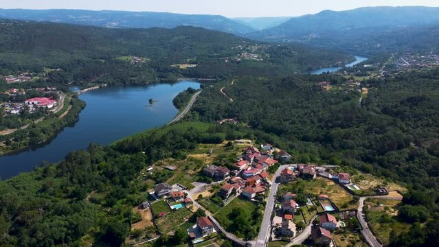 mi&ntilde;o river and winding roads of velle, ourense, galicia, spain, aerial dolly