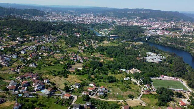Calm peaceful countryside town bordered by river and forest mountains, velle and ourense