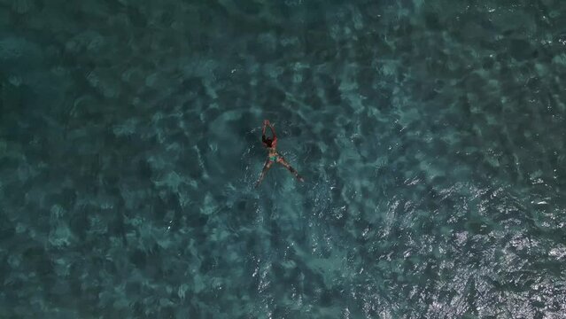 girl in the water Tamarindo beach on Culebra, puerto rico