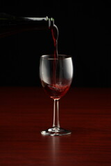 red wine served on a glass of wine at the table