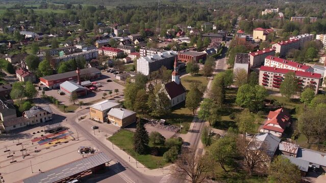 A small border town in Latvia. Valka city at sunset. Drone flight over the city
