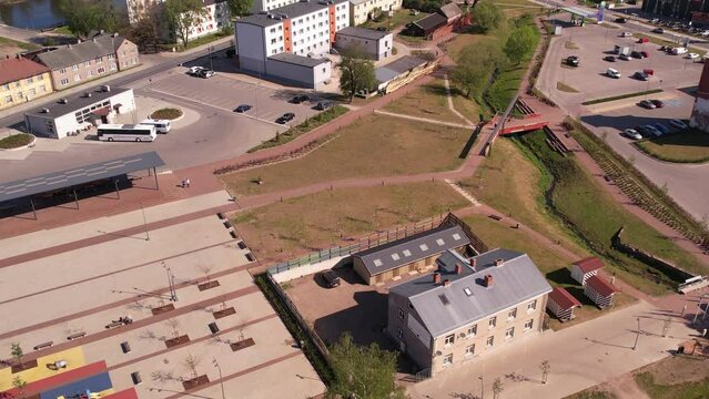 A small border town in Latvia. Valka city at sunset. Drone flight over the city
