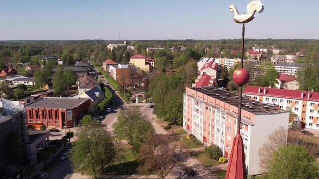 A small border town in Latvia. Valka city at sunset. Drone flight over the city