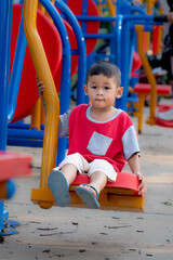 Fototapeta na wymiar child playing on the playground