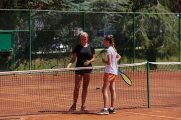 Tennis players standing together on the tennis court, poised and focused, preparing for the start of their match