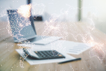 Multi exposure of abstract creative digital world map hologram on blurry calculator with laptop...
