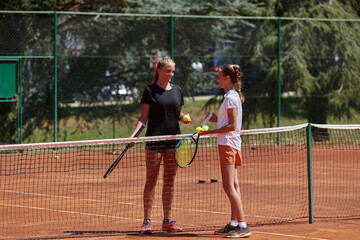 Tennis players standing together on the tennis court, poised and focused, preparing for the start of their match