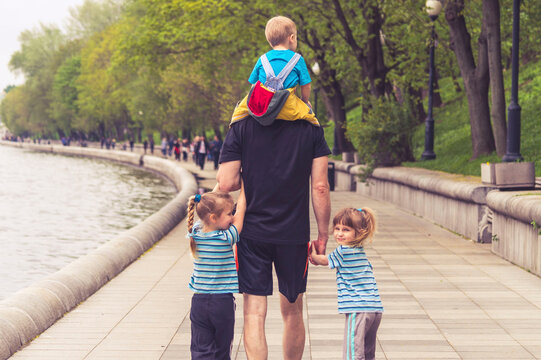 Father with his children taking the funniest and longest walk on Father's Day