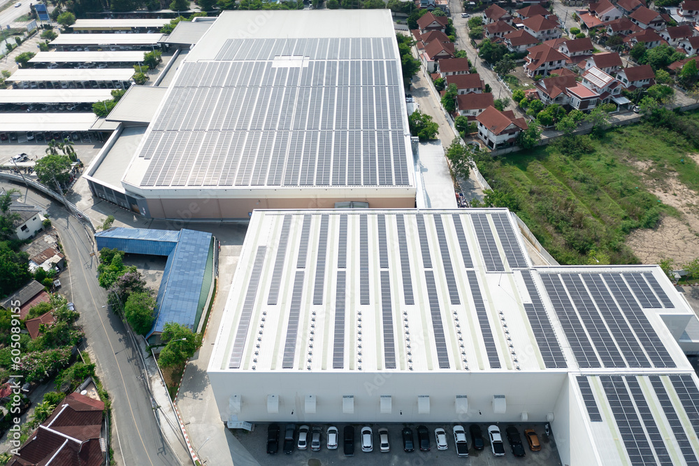 Wall mural eco building, shopping center in aerial view. solar cell or photovoltaic cell in panel on top of roo