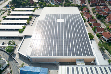 Eco building, shopping center in aerial view. Solar cell or photovoltaic cell in panel on top of roof to generate electrical power or direct current electricity. Green, clean energy for future. © DifferR